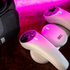 Quell Impact controllers in pink mood lighting